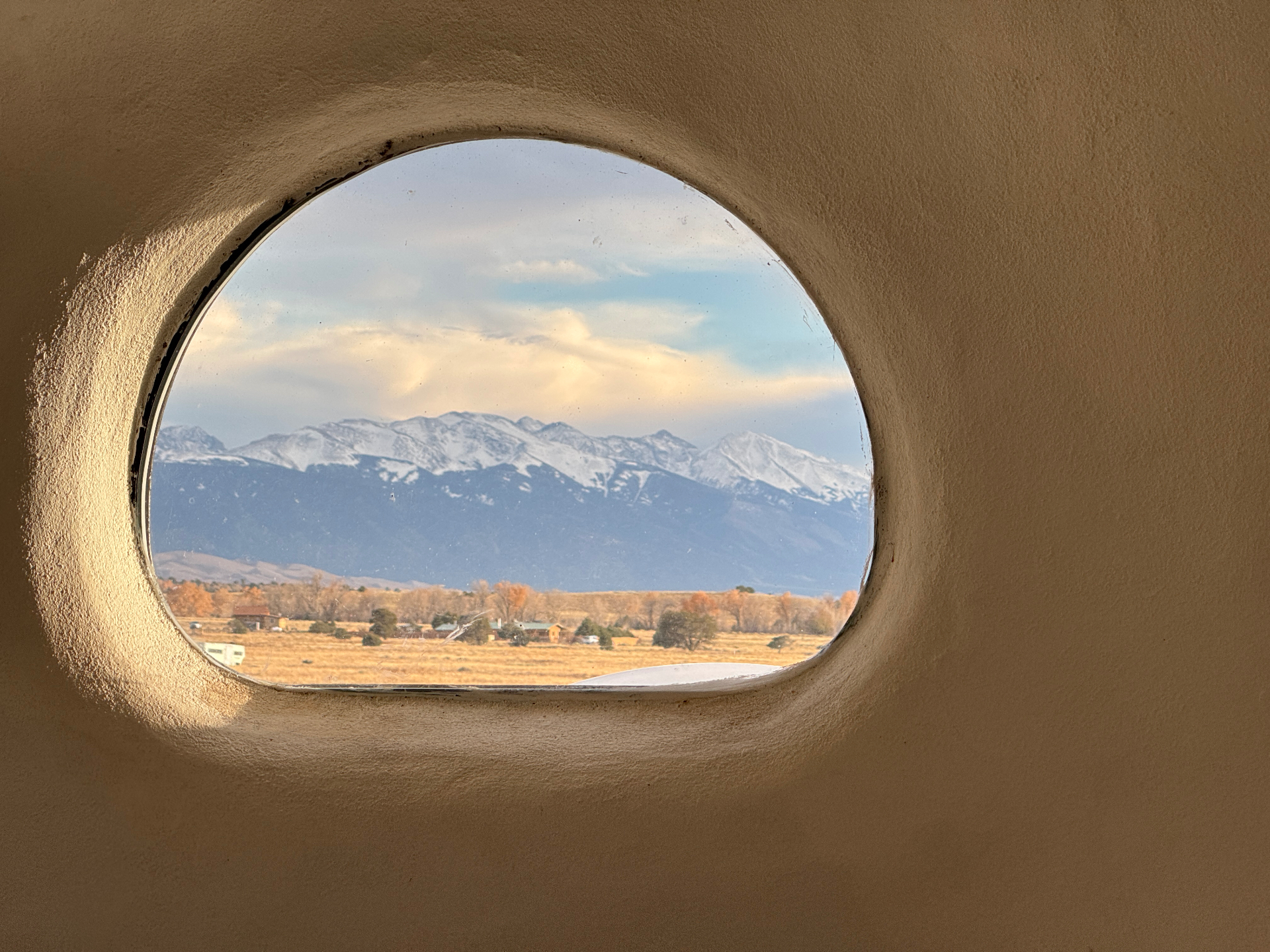 Quiet mountain view framed through a window